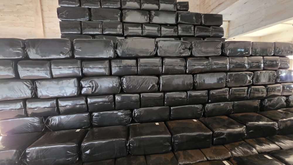 Stacks of bagged coco peat bales in the despatch shed
